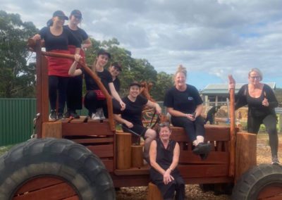 The cafe staff on a playground tractor